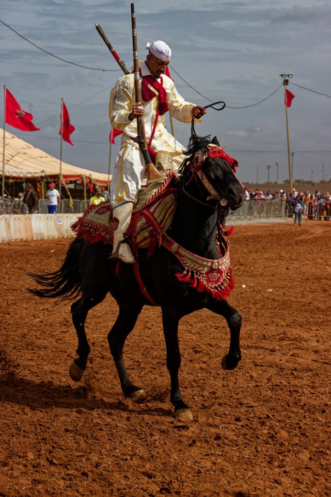 pexels-photo-30356661-30356661 A rider in traditional attire participates in Maroc's Tbourida festival.