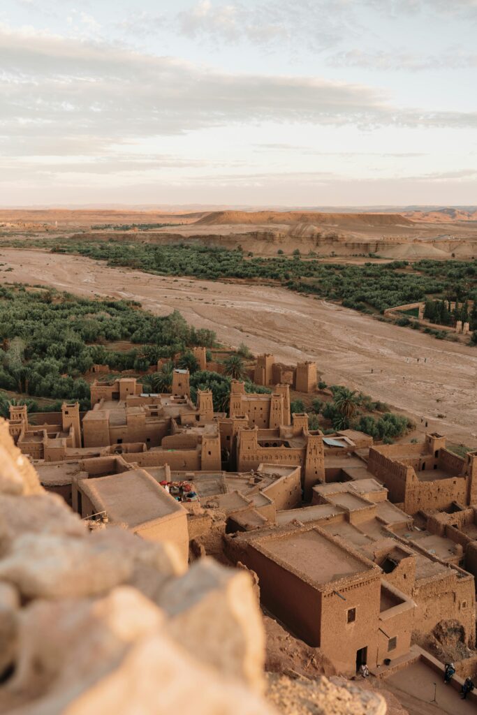 Stunning aerial shot of Ouarzazate's ancient Kasbah in Morocco's arid landscape.