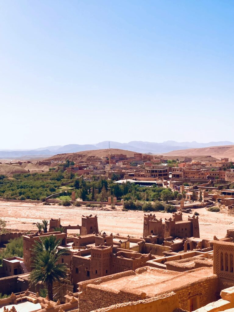 Breathtaking landscape of Aït Benhaddou, an iconic fortified village in Morocco, under a clear sky.